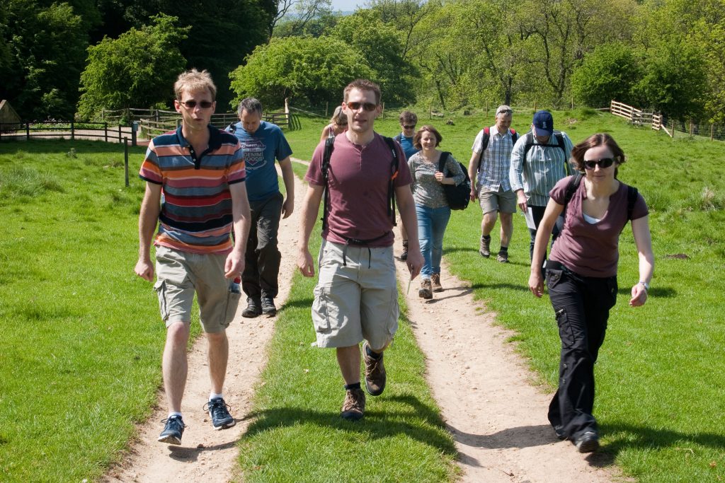 The group walking on a dirt track