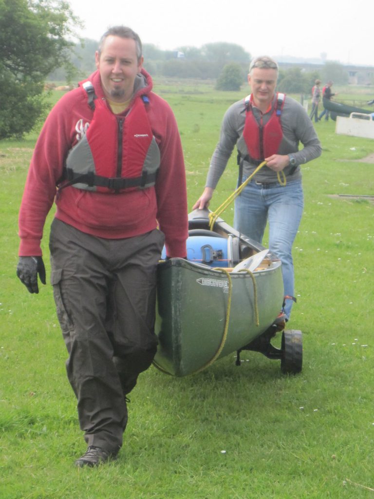 Chris and James pulling their canoe to the water