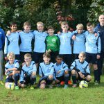 Group football photo of the team and coaches