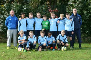 Group football photo of the team and coaches