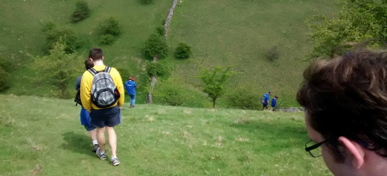 Walking down a steep drop into the valley